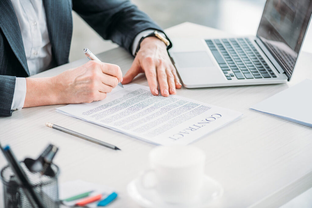 Illustration of professionals reviewing documents related to BVI Beneficial Ownership compliance