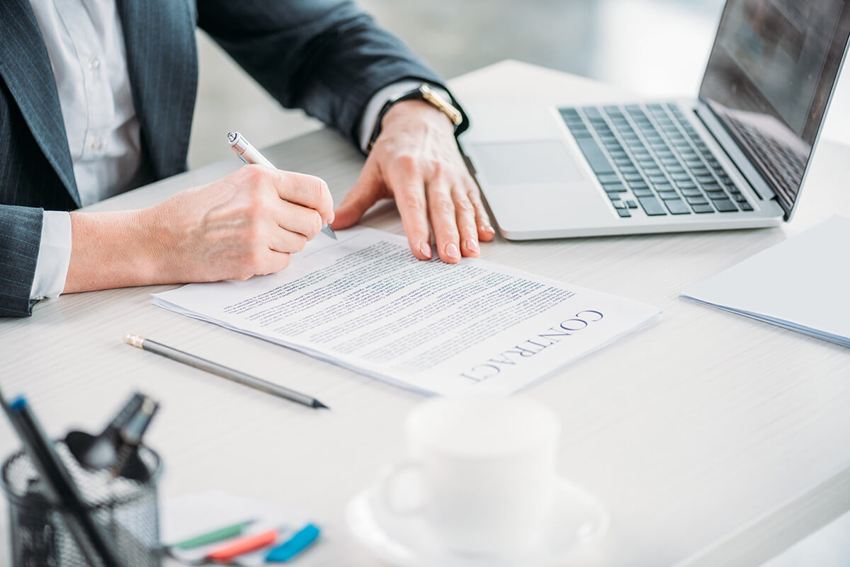 Illustration of professionals reviewing documents related to BVI Beneficial Ownership compliance